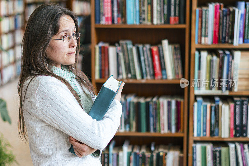 Back to school 2020. Young female student in the campus library. COVID-19 reality. New normal.